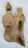 Close-up of an ancient Mediterranean terracotta figural group displaying weathered surfaces and archaeological encrustation.