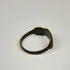 Ancient silver finger ring showing a weathered clustered bezel and centuries-old natural patina