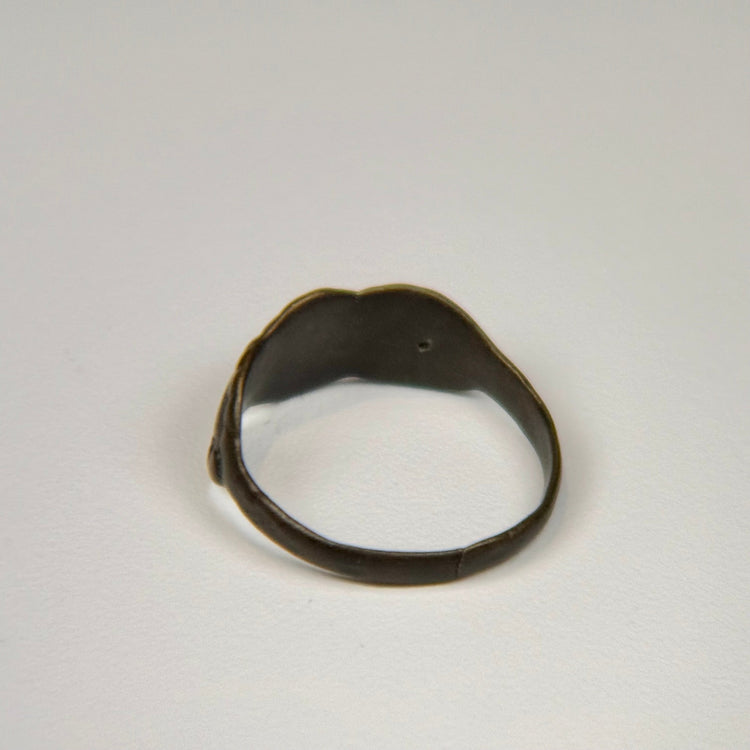 Ancient Eastern Mediterranean silver ring with clustered oval design and preserved historic band