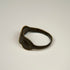 Late Roman silver ring displaying three balanced oval forms across the decorative bezel