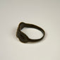 Late Roman silver ring displaying three balanced oval forms across the decorative bezel