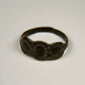Early Byzantine silver finger ring featuring a distinctive three-oval clustered bezel design