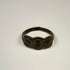 Ancient silver ring with intact band, textured patina, and prominent three-part oval bezel