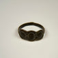 Ancient silver ring with intact band, textured patina, and prominent three-part oval bezel