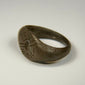 Late Roman silver ring displaying a clear celestial sunburst motif on the central bezel