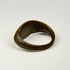 Ancient Eastern Mediterranean silver ring with engraved sunburst symbol and rounded band