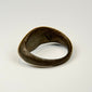 Ancient Eastern Mediterranean silver ring with engraved sunburst symbol and rounded band