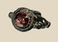 Ancient silver ring from the Eastern Mediterranean or Near East, Late Roman to Early Byzantine period (circa 300–600 CE), featuring a deep red garnet intaglio engraved with symbolic imagery, flanked by decorative silver nodes, preserving its historical elegance and craftsmanship.