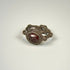 Early Byzantine silver and garnet ring showing the engraved intaglio set within a raised circular bezel
