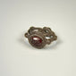 Early Byzantine silver and garnet ring showing the engraved intaglio set within a raised circular bezel