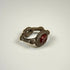 Ancient garnet intaglio signet ring with decorative silver shoulders and preserved dark red gemstone