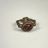 Late Roman to Early Byzantine silver ring displaying the engraved garnet intaglio, aged patina, and ornamental bezel design