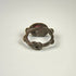 Ancient silver intaglio ring showing the circular band, aged patina, and elevated garnet bezel