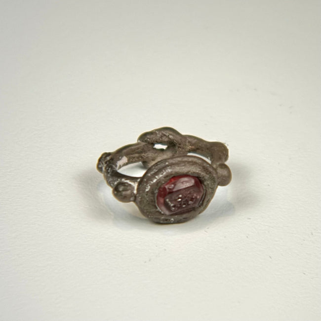 Ancient Roman silver ring with polished red garnet intaglio and naturally aged silver patina