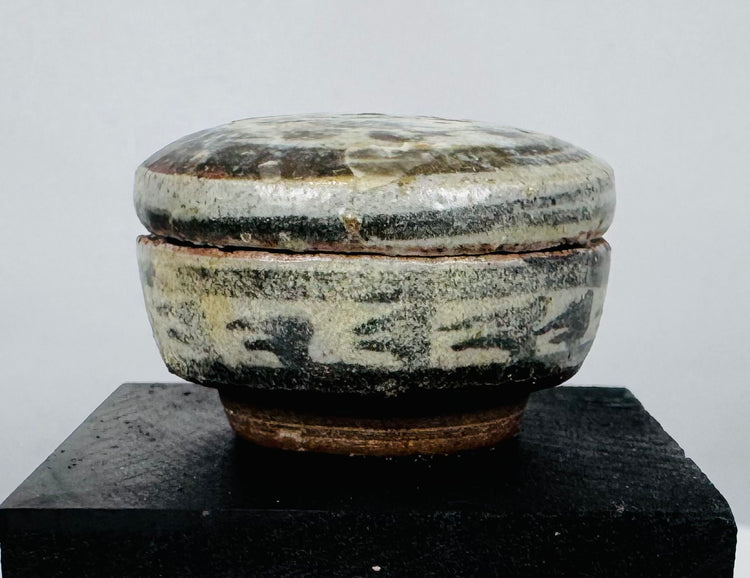 Authentic Sawankhalok export ware group featuring four miniature glazed vessels from the Sukhothai Kingdom of Thailand.