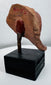Ancient figural ceramic fragment mounted on display stand, retaining painted decoration and burial patina