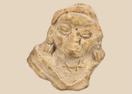 Terracotta fragment of a stylized anthropomorphic figure with almond-shaped eyes, prominent nose, and incised chest details, mounted on a modern wood base; likely from West Mexico (Nayarit or Jalisco) or Iberian/Roman provincial context, circa 200 BCE–2nd Century CE.