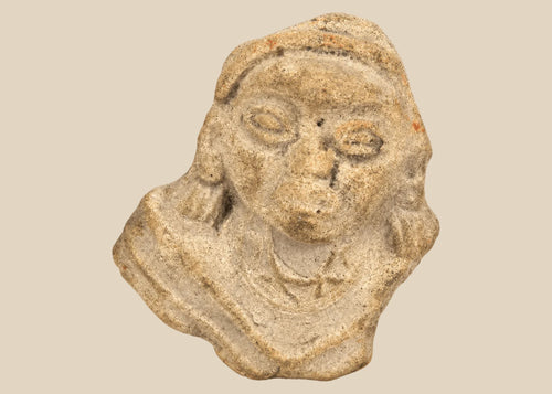 Terracotta fragment of a stylized anthropomorphic figure with almond-shaped eyes, prominent nose, and incised chest details, mounted on a modern wood base; likely from West Mexico (Nayarit or Jalisco) or Iberian/Roman provincial context, circa 200 BCE–2nd Century CE.