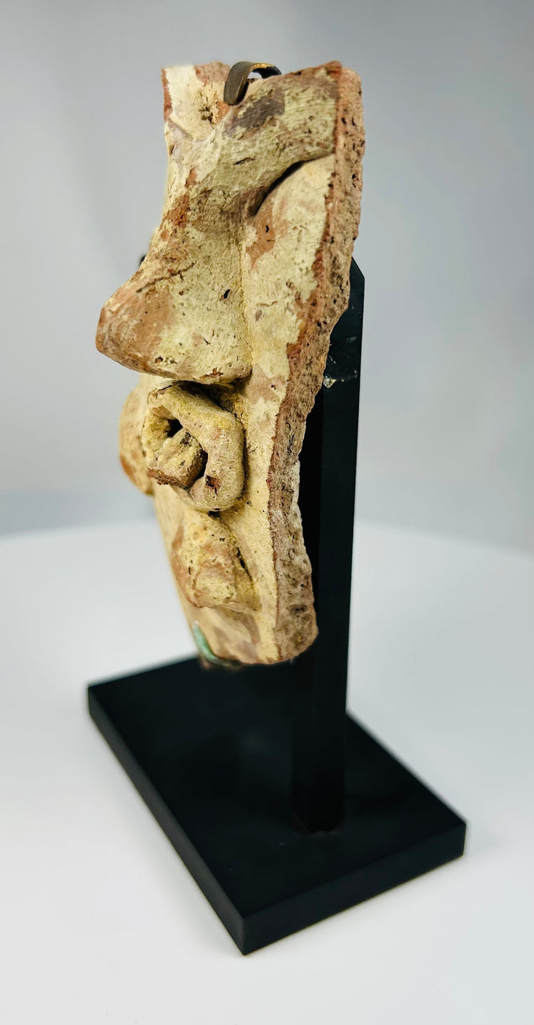 Authentic ancient Mediterranean terracotta theatrical mask fragment associated with Dionysian theater culture.