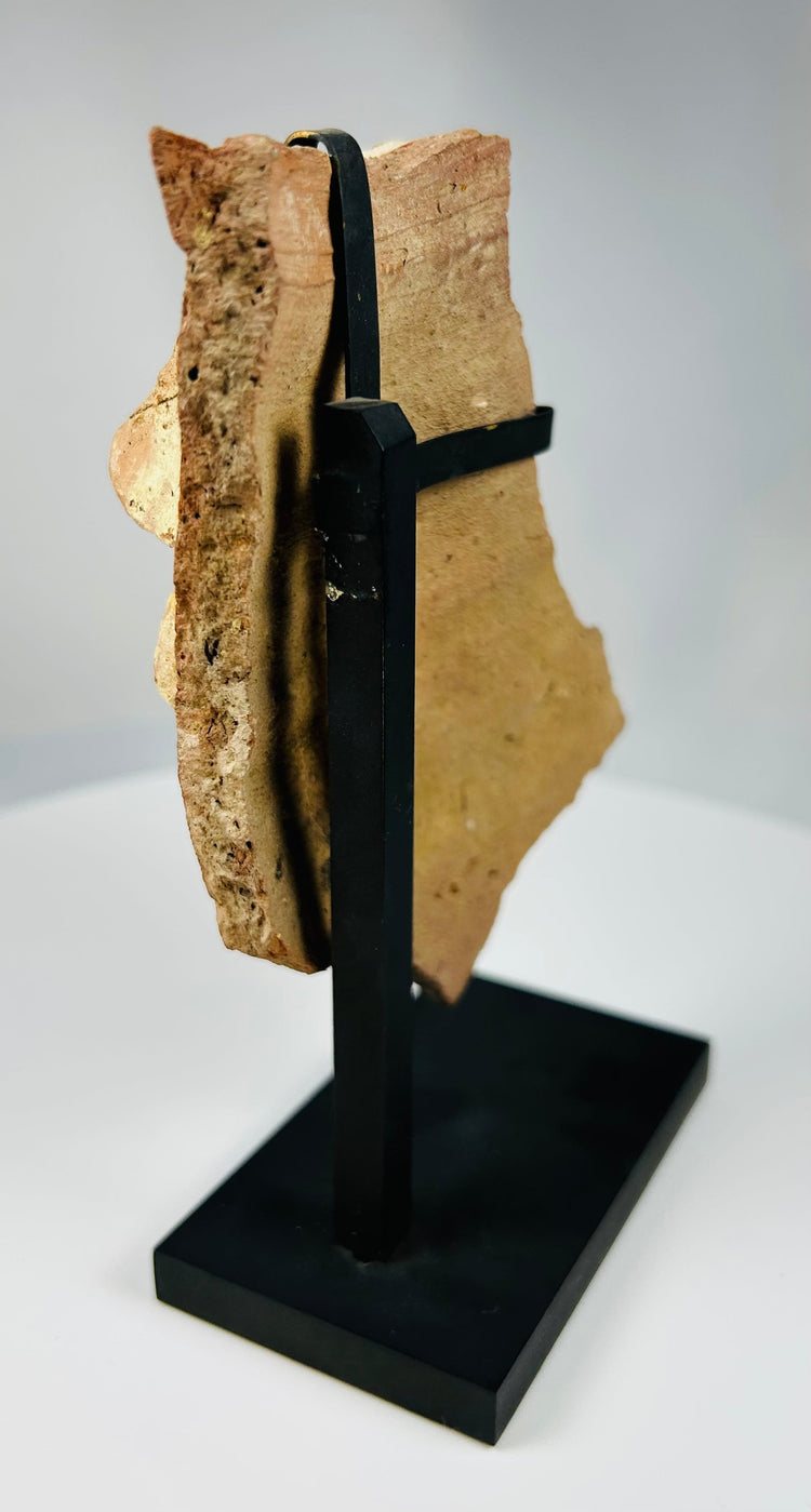 Hellenistic-Roman terracotta theatrical mask fragment showing detailed eye socket and open mouth expression.