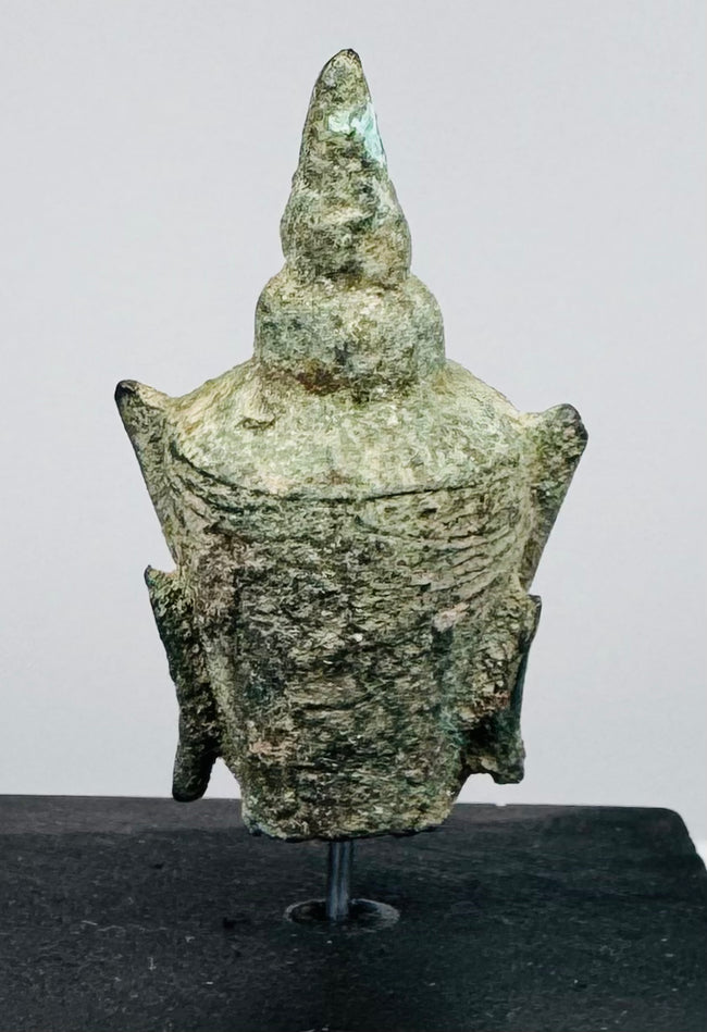 16th–17th century Buddhist sculpture featuring a finely cast bronze Buddha head with green oxidation