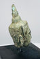 Small bronze Buddha head artifact from Southeast Asia with traditional Buddhist iconography and natural patina