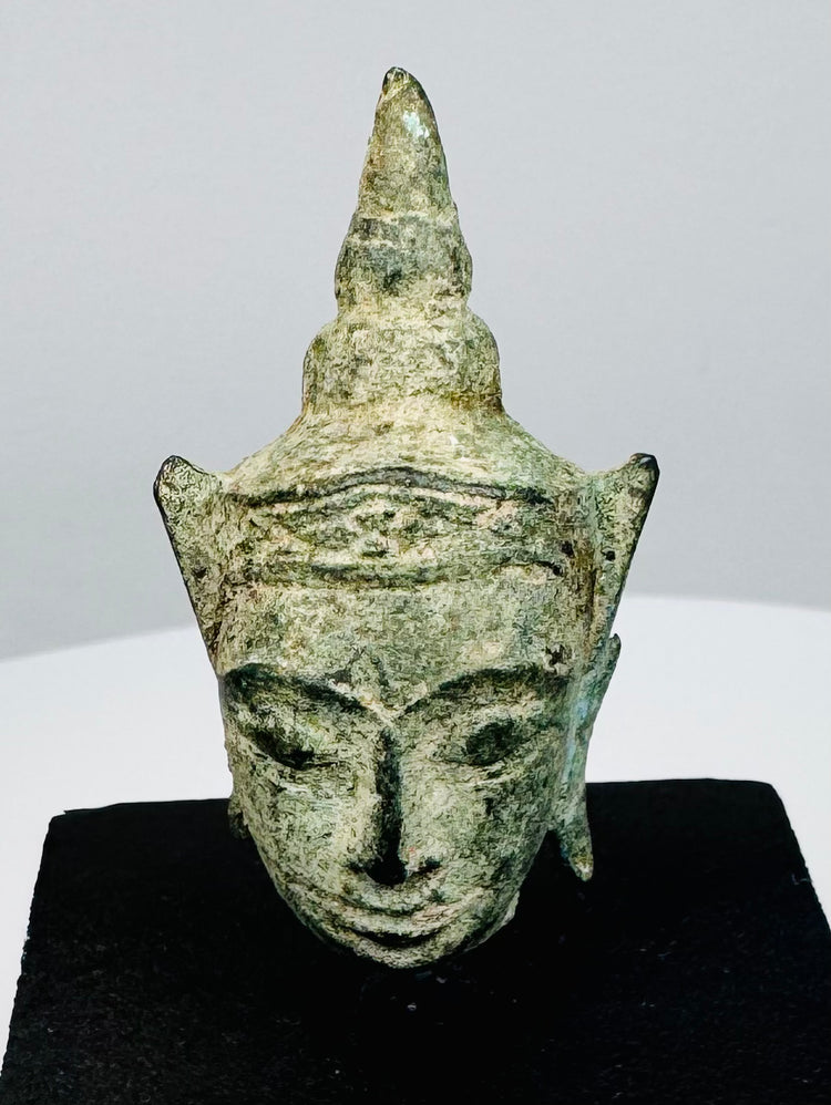 16th–17th century Southeast Asian bronze Buddha head with natural green patina and pointed ushnisha