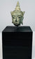 Antique Thai or Cambodian Buddha head sculpture with elongated earlobes and aged bronze surface