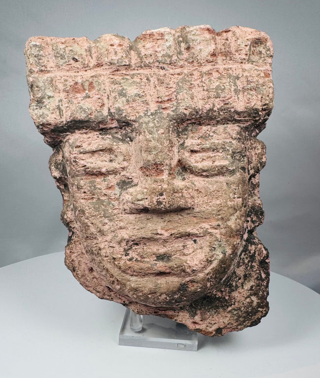 Classic Veracruz stone sculpture with a broad stepped headdress