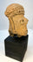 Pre-Columbian clay portrait head with carved facial features and headdress