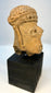 Pre-Columbian clay portrait head with carved facial features and headdress