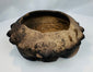 Ancient Colima, Jalisco, or Nayarit tripod ceramic bowl featuring hollow legs and sculpted animal heads around the rim.