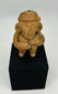 Ancient Mesoamerican terracotta figure with ritual seated pose and subtle traces of original pigment