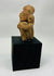 Expressive Pre-Columbian terracotta ancestor figure with stylized facial features and ear ornaments