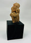 Expressive Pre-Columbian terracotta ancestor figure with stylized facial features and ear ornaments