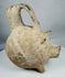 Ancient Anatolian Yortan Culture ceramic pig vessel featuring traces of white slip and archaeological patina.