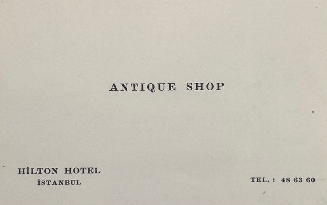 Original Hilton Hotel Antique Shop business card from Istanbul, Turkey, accompanying the documented provenance of the Ancient Yortan Culture terracotta pig-shaped vessel purchased on September 9, 1966.