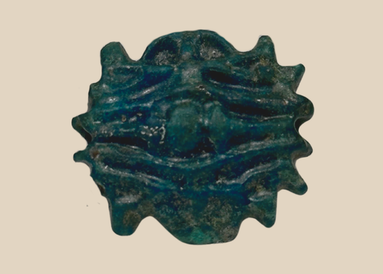 Ancient Egyptian blue-green faience rosette amulet bead with central perforation