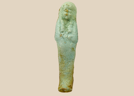 Ancient Egyptian faience Ushabti figure with pale blue-green glaze and burial deposits