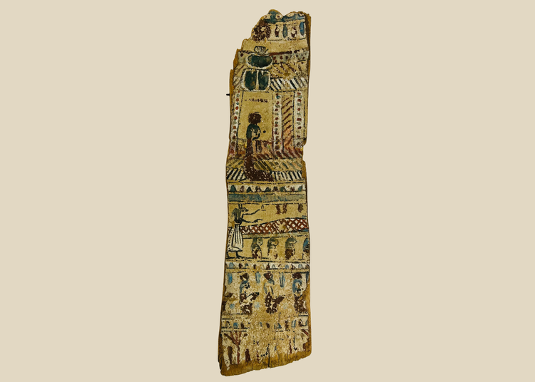 Front view of ancient Egyptian painted coffin fragment with colorful hieroglyphic scenes on beige background