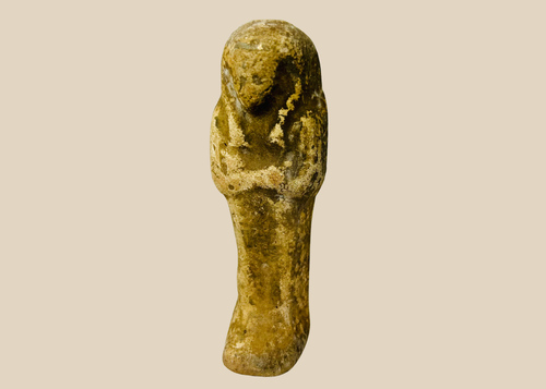 Ancient Egyptian sandstone ushabti figurine displayed on a white background.