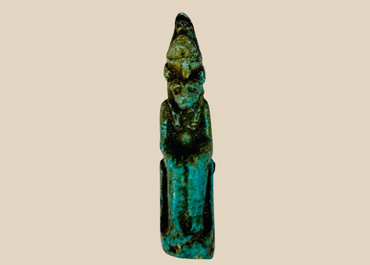 Ancient Egyptian seated Sekhmet amulet carved in stone, front view.