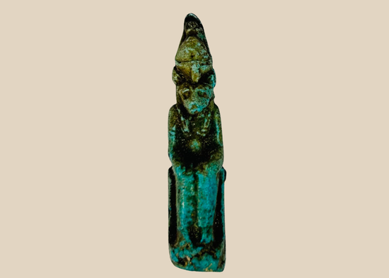 Ancient Egyptian seated Sekhmet amulet carved in stone, front view.