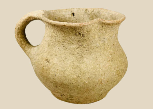 Ancient Greco-Roman terracotta pitcher, 1st–3rd century CE, with single rounded handle, wide mouth, and aged earthen surface.