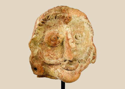 Shunga period terracotta head, 2nd–1st century BCE, with naturalistic facial features, red terracotta surface, and subtle stylization.