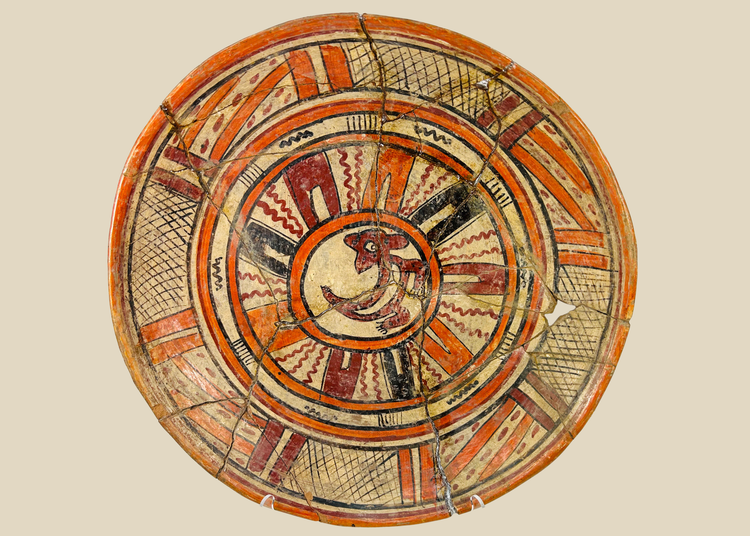 Ancient Mesoamerican polychrome ritual plate with vivid zoomorphic motif and geometric border, circa 300 BCE–300 CE.