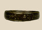 Ancient Roman bronze band ring, 1st–4th Century CE, featuring incised decorative motifs around the circumference. Worn as personal adornment and possibly symbolic of status or identity, with natural patina from centuries of age and use.