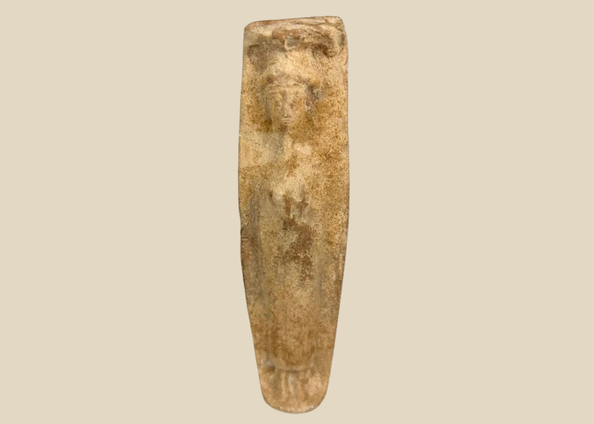 Ancient Roman fertility pottery figure, circa 1st–3rd century CE, carved terracotta form with faint human features and aged surface patina.