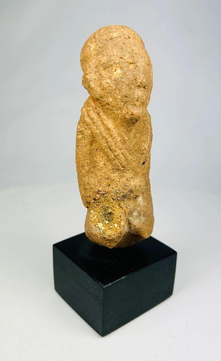 Ancient Sokoto terracotta figurine, West Africa, circa 500–200 CE, hand-modeled clay figure with stylized features and weathered patina, mounted on a display stand.
