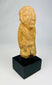 Ancient Sokoto terracotta figurine, West Africa, circa 500–200 CE, hand-modeled clay figure with stylized features and weathered patina, mounted on a display stand.